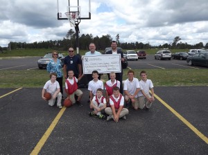 RCCF Executive Director Suzanne E. Luck, Athletic Coach Joe Luesby, RCCF Chairman Ron Duquette, CHA Superintendent David Patterson, and along with several students.